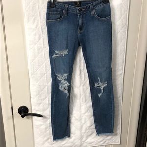 Distressed blue jeans